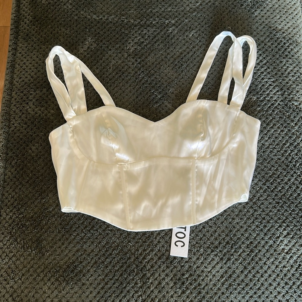 White corset top with zipper on back with double straps